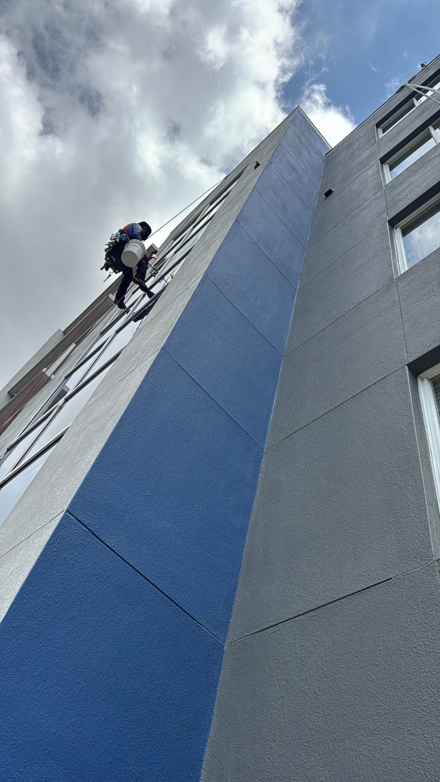 Window cleaner descending a tall commercial building